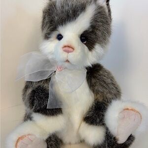 Adorable Black and White Plush Cat with Bow